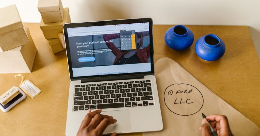 Workspace with laptop, packaging, and handwritten LLC notes, ideal for a small business startup scene.